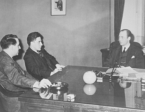 Pehle (right) in his office with other members of the War Refugee Board.