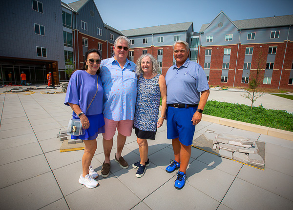 From left: Judy and Lee Graves, and Kathy and Jim Simpson, standing in the Simpson Family Courtyard of Graves Hall.
