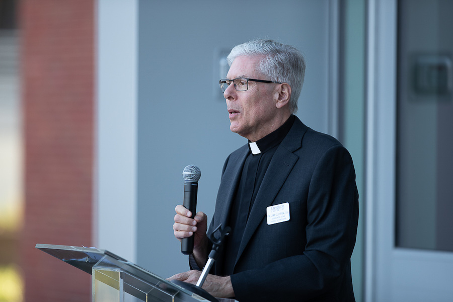 Father James Clifton, SJ, speaks at the event.
