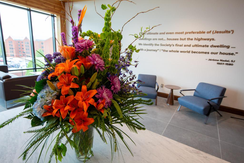Flowers sit on a table inside the Jesuit Residence