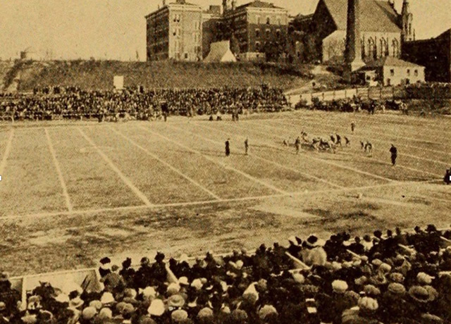 Shot of Creighton football field and crowd/players in the 1920s.