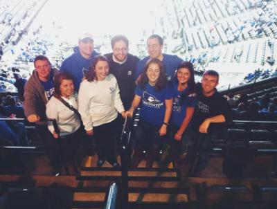 Friends gather for a photo at a Creighton basketball game in 2013