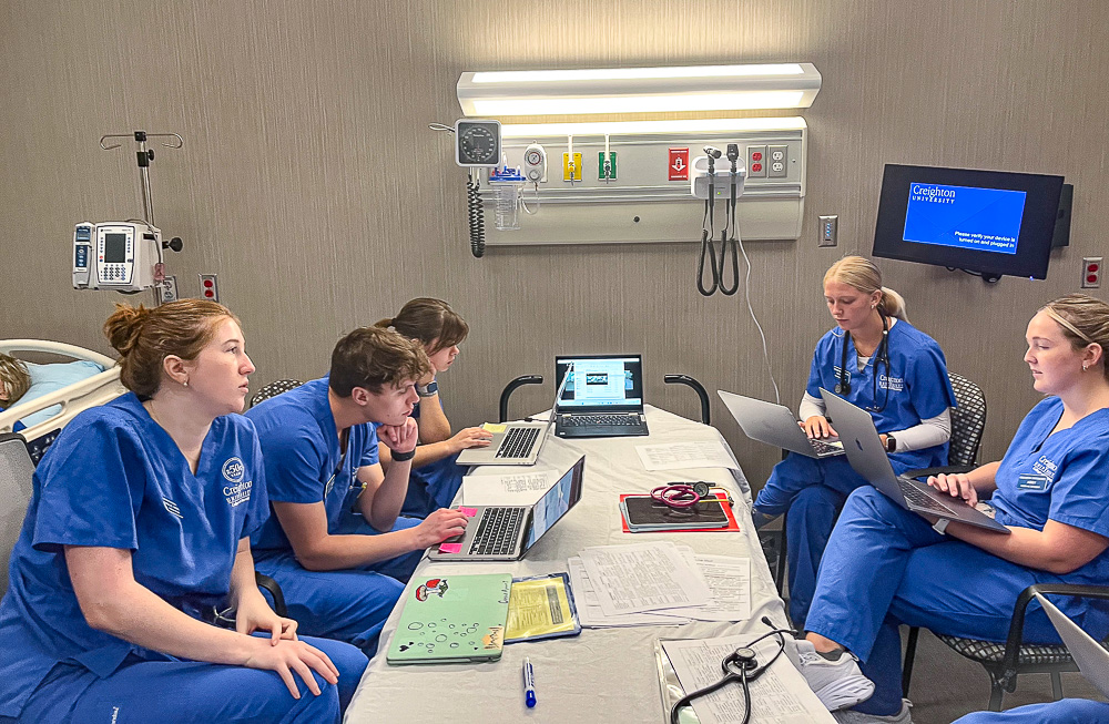 Nursing students in a simulation room.