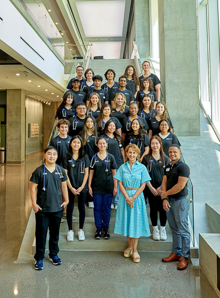 Christy Burton, bottom right corner, pictured in July with Summer Health Institute students at Creighton's Phoenix campus.
