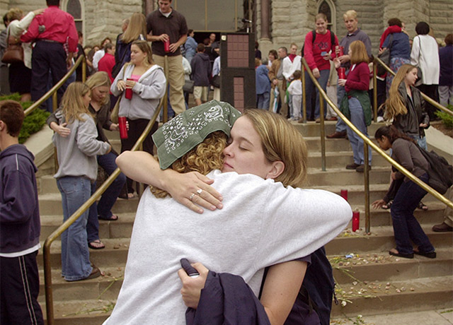 Students embrace on the St. John's steps at a prayer mass on 9/11.