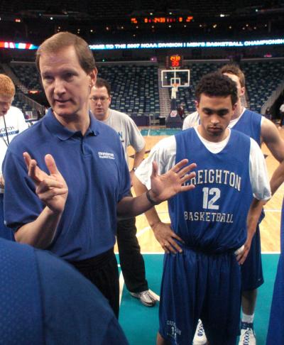 A coach talks to players