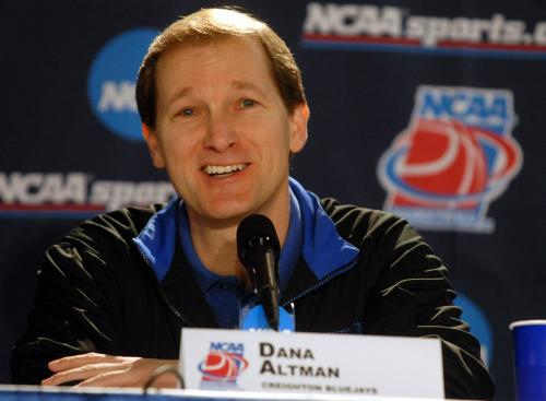 A coach talks at a press conference