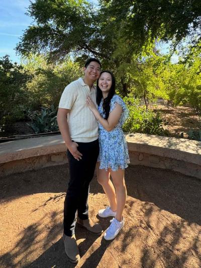 A man and a woman pose together for a photo
