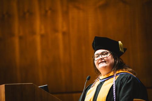 A dean speaks at a ceremony