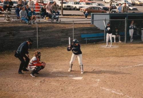 A softball player gets ready to swing a bat