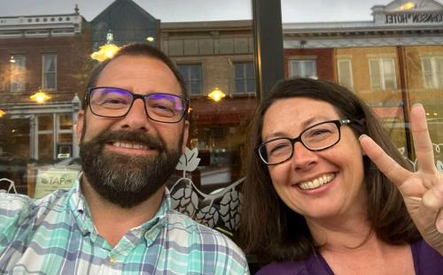 A man and a woman pose for a selfie