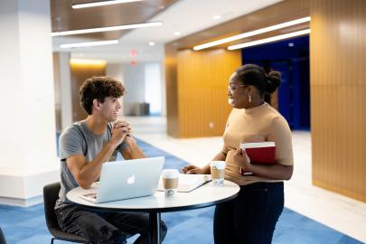 Students talk in the Harper Center