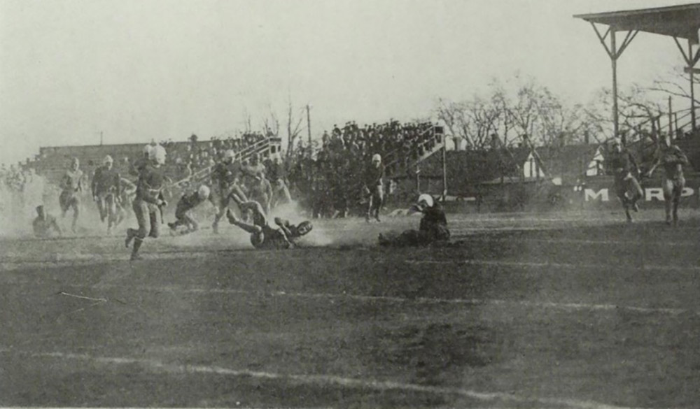 The Creighton football team plays a game in the early 1920s.