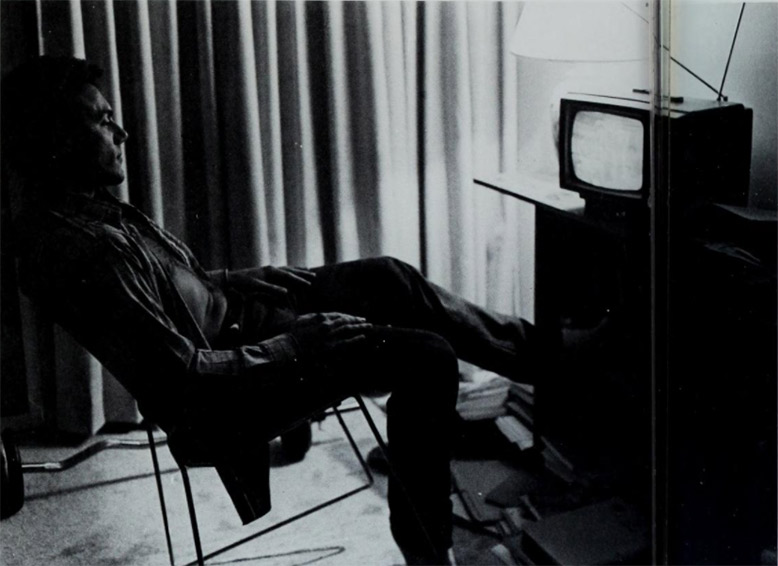 A student watches TV in Gallagher Hall.