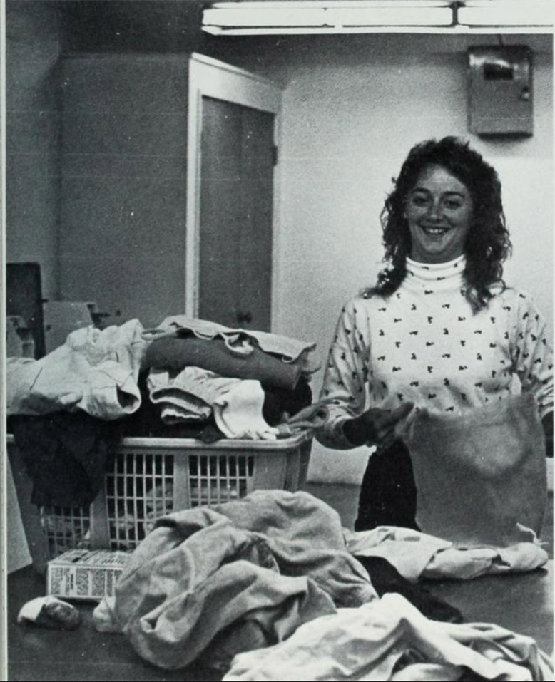 A student does her laundry in Gallagher.