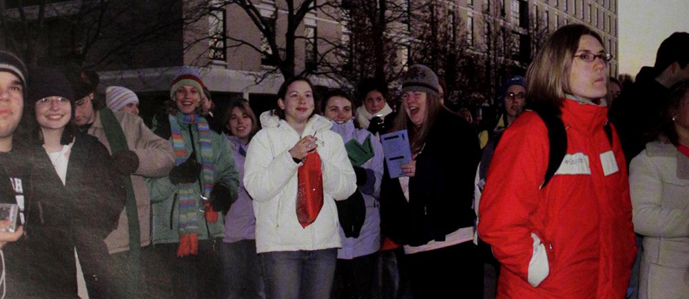 Students watch the Christmas tree lighting.