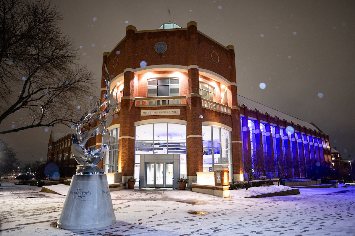 Harper Center at night in the snow.
