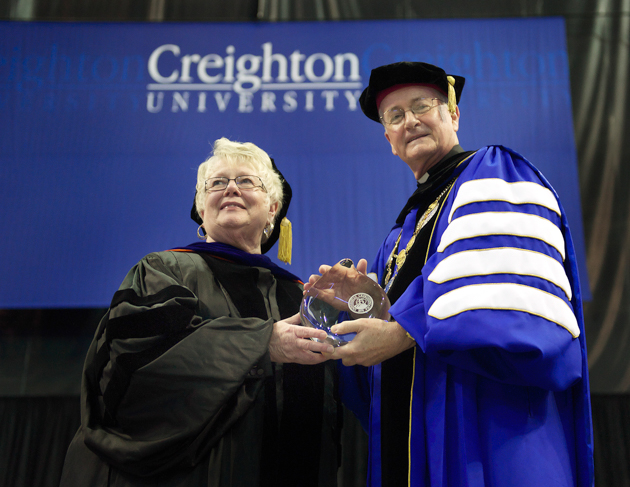 Barbara Braden with then-President Rev. Timothy Lannon, SJ, EdD, BS'73, when she received the Alumni Achievements Citation in 2013.