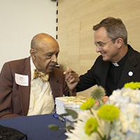 Lester L. Carter Jr., BSPHA'58 talks to Creighton President the Rev. Daniel S. Hendrickson, SJ, PhD.