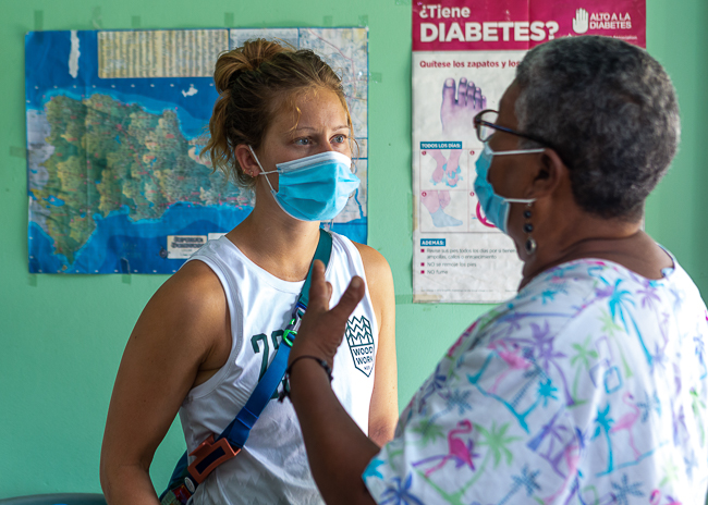 A student speaks with a nurse during an ILAC trip in the Dominican Republic. 