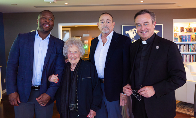 From left: Marcus Blossom, Ruth Scott, Don Scott and Fr. Hendrickson at a gathering celebrating The Bill.