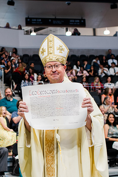 James Golka, Installation Ceremony holding paper