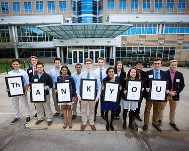 Creighton students holding signs that spell out thank you