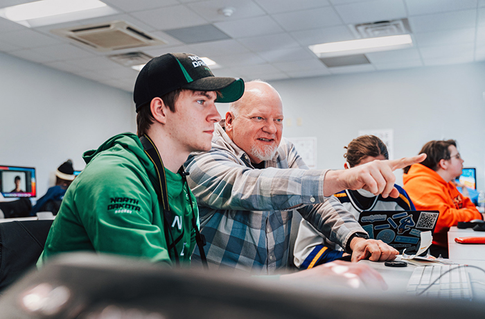 Tim Guthrie and a student talk.