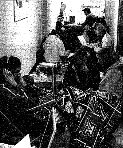 Black and white photo of a crowded hallway