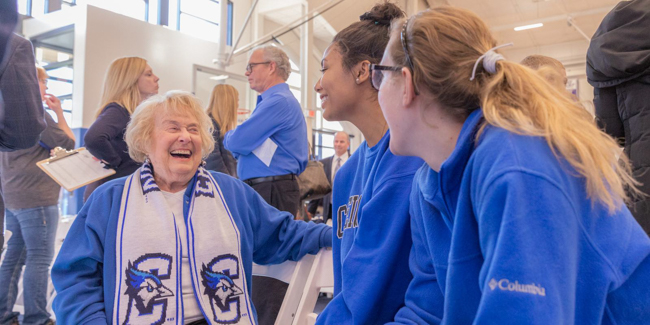 Ruth Scott greeting student-athletes in 2019.