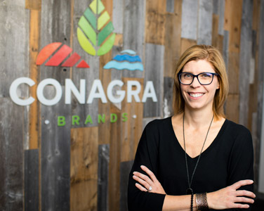 woman standing before Conagra sign