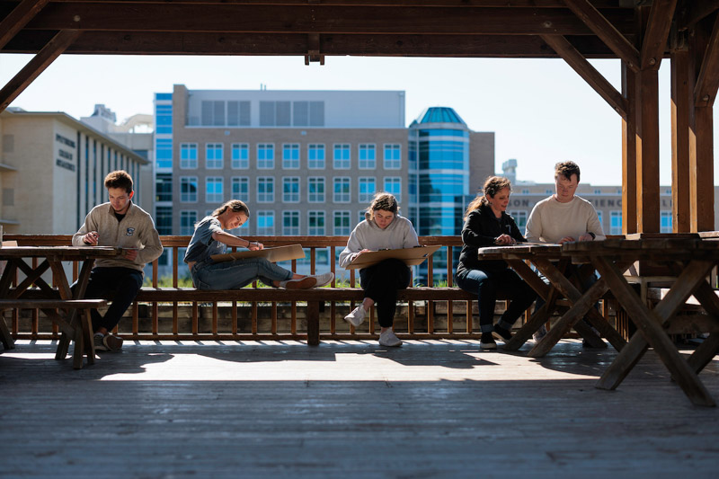 Images of students on the pavilion. 