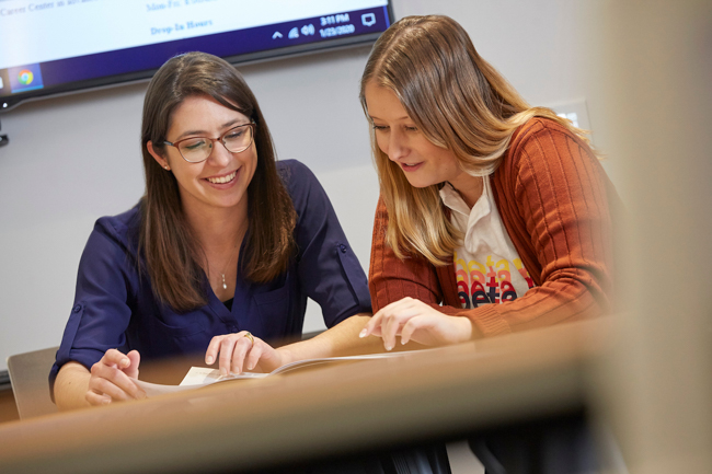 A staff member helps a student in the Career Center.