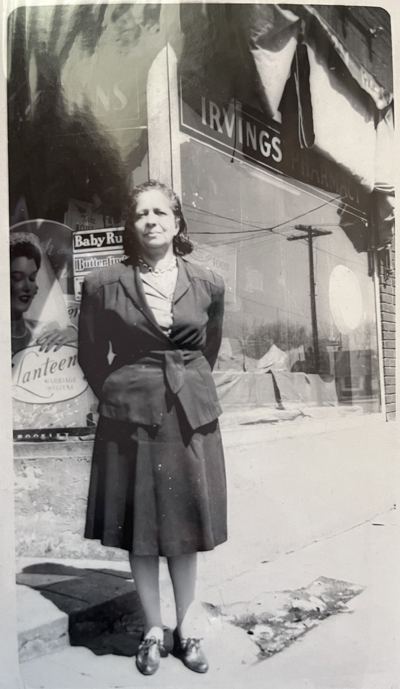 Cassie Chancellor in front of Irving's Pharmacy.