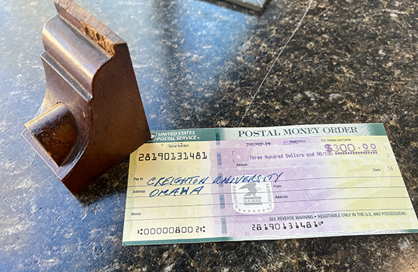 The block of wood and the money order