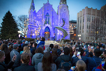 St. John's Cathedral lit up in blue lights on Creighton campus