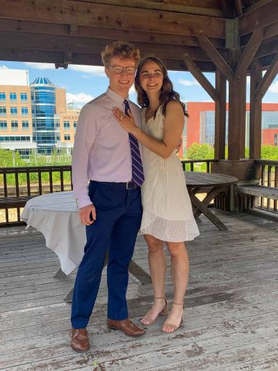 A man and a woman pose together for a photo