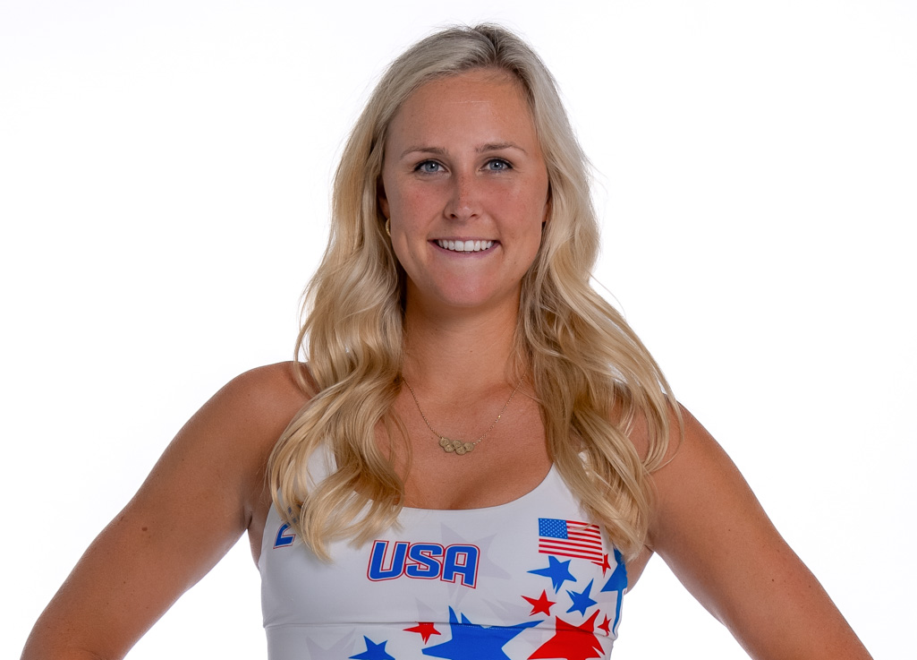 Taryn Kloth, wearing Team USA gear, smiles as she poses for a photo