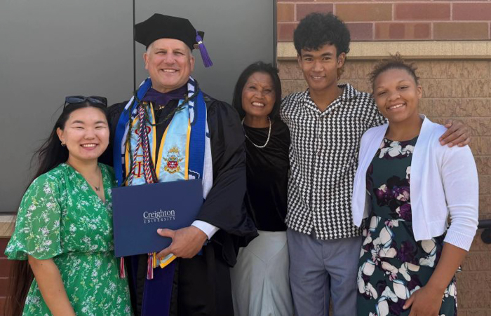 Matthew and Rose Badell with their children at Creighton commencement in May 2025.