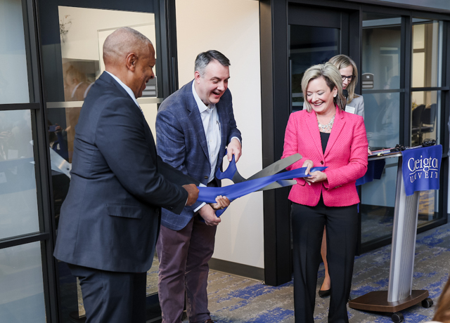 Mayor Ewing, Scott Shipman and Chanda Chacon cut the ribbon at the Child Safety Center event.