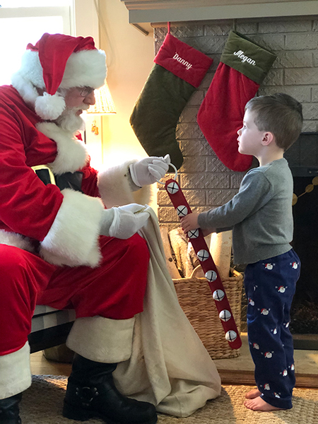 Coming full circle ... here's Rod Jewell as Santa with Charlie McKinzie, son of Daniel McKinzie and Megan Knowles McKinzie, and great-grandson of Pinky Knowles. 