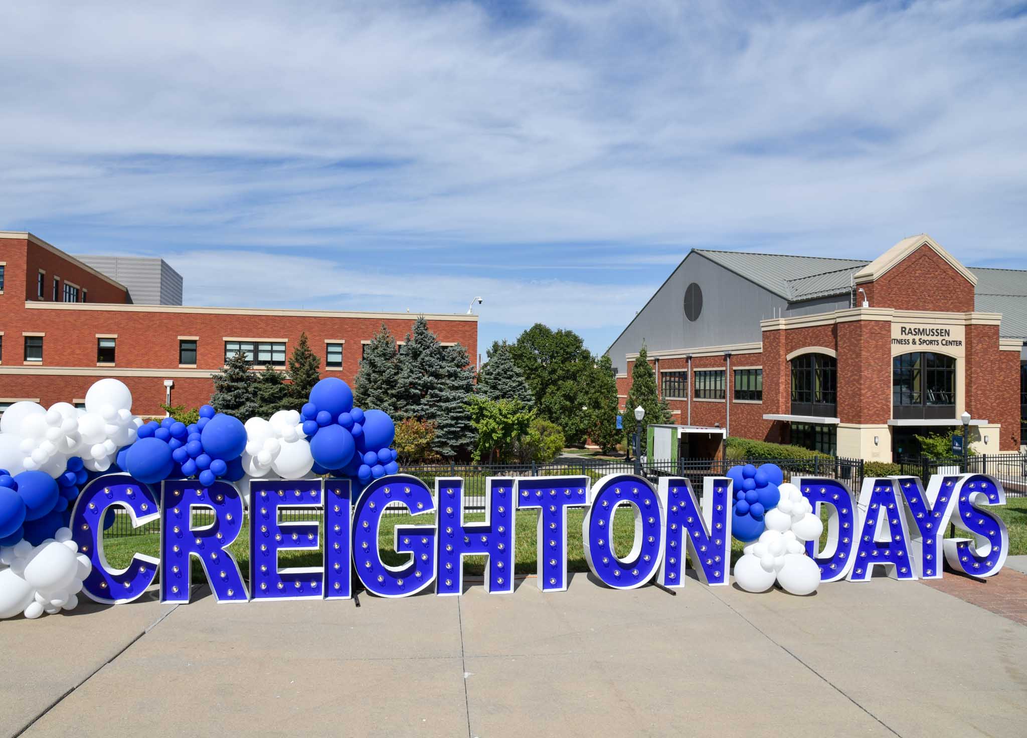 Illuminated letters spell out Creighton Days on a sign inside Morrison Stadium