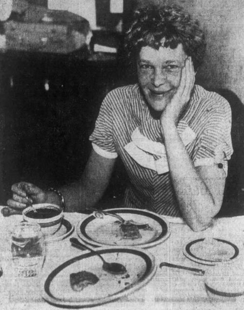 1933 photo of Amelia Earhart eating breakfast