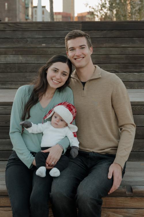 Isabel and Jack Peterson smiling together with their son, Colin.