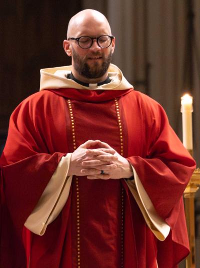 A priest closes his eyes to pray