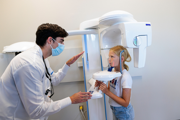 A dental student works with a pediatric patient in the School of Dentistry's pediatric clinic.