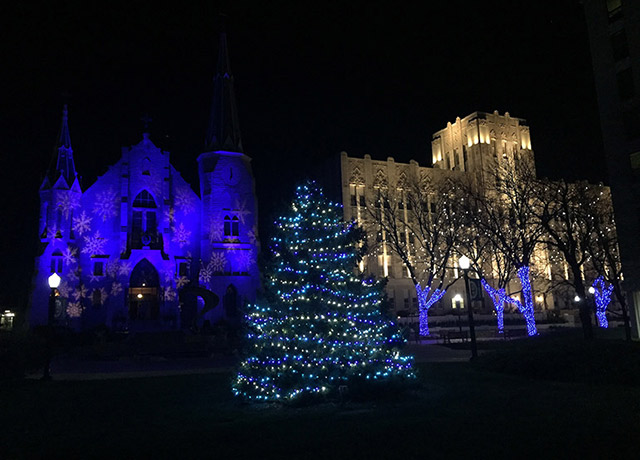St. John's and Creighton Hall illuminated for the holidays.