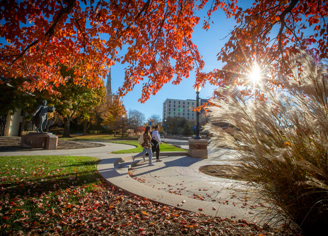 Images of students walking the campus during fall.