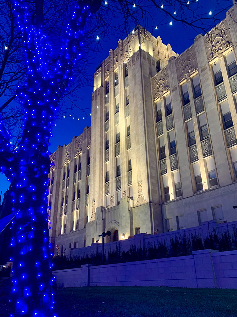 A Christmas scene in front of Creighton Hall.