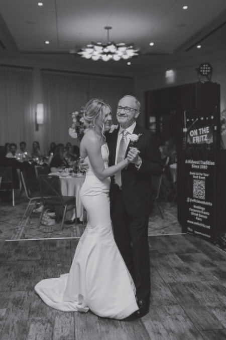 Dr. Vrbicky dances with his daughter Michaela at her wedding reception in 2022.